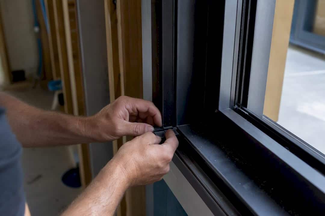 Close-up of thermal-break window frame installation