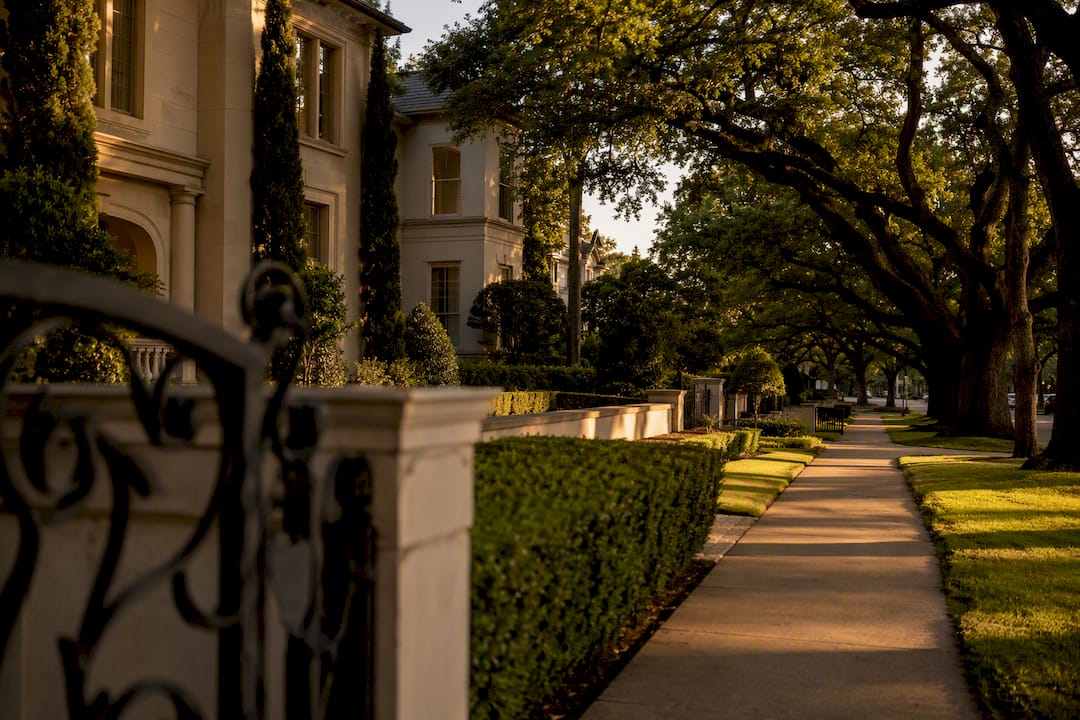 Tree-lined River Oaks luxury neighborhood street