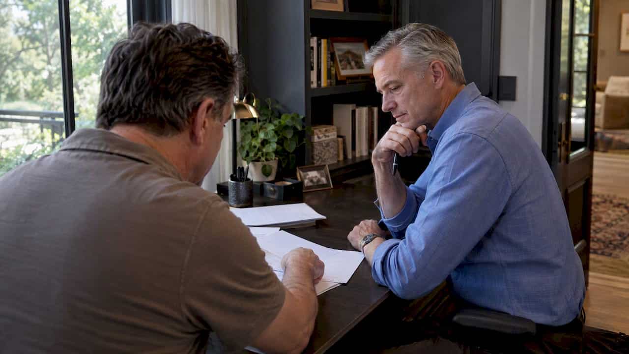 Buyer and agent review a Houston luxury home contract
